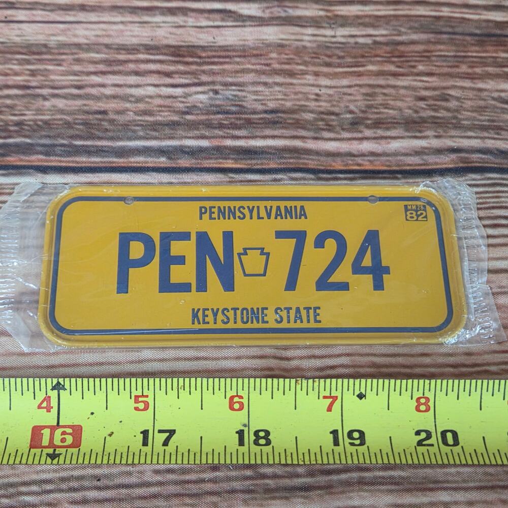 Vintage steel mini license plate Pennsylvania yellow sealed 1980s